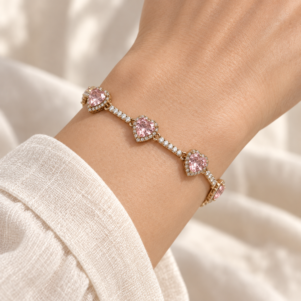 Close-up of the Blush Heart Sparkle Bracelet fitted snugly around a wrist, with pink hearts and clear sparkling bar links.