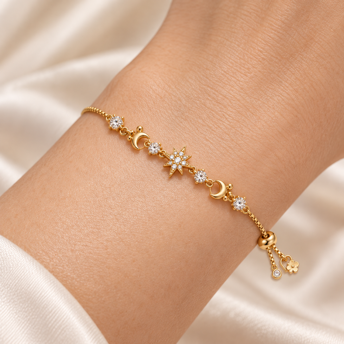 Close-up of the Celestial Sparkle Slider Bracelet fitted snugly around a wrist, showing its central starburst, crescent motifs and short slider tails.