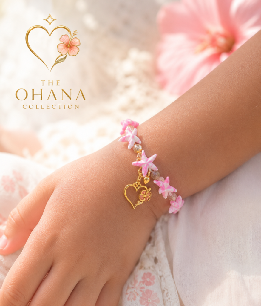 The Ohana Collection Pink Seastar bracelet with logo on a womans wrist.