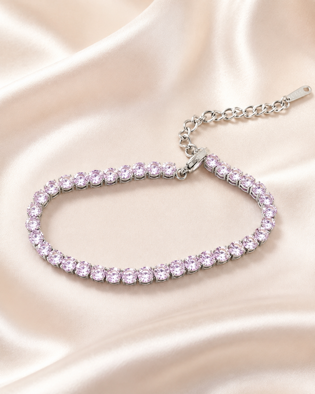 Close-up of Blush Shimmer Bracelet showing pastel pink and lavender stones in a polished silver-tone setting.