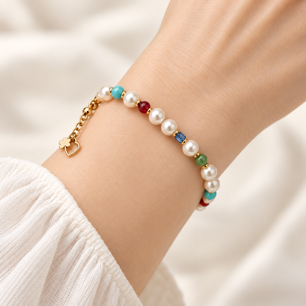 Color Pop Pearl-Style Bracelet fastened in a close-fitting loop around the wrist, showing white beads and colorful accents.