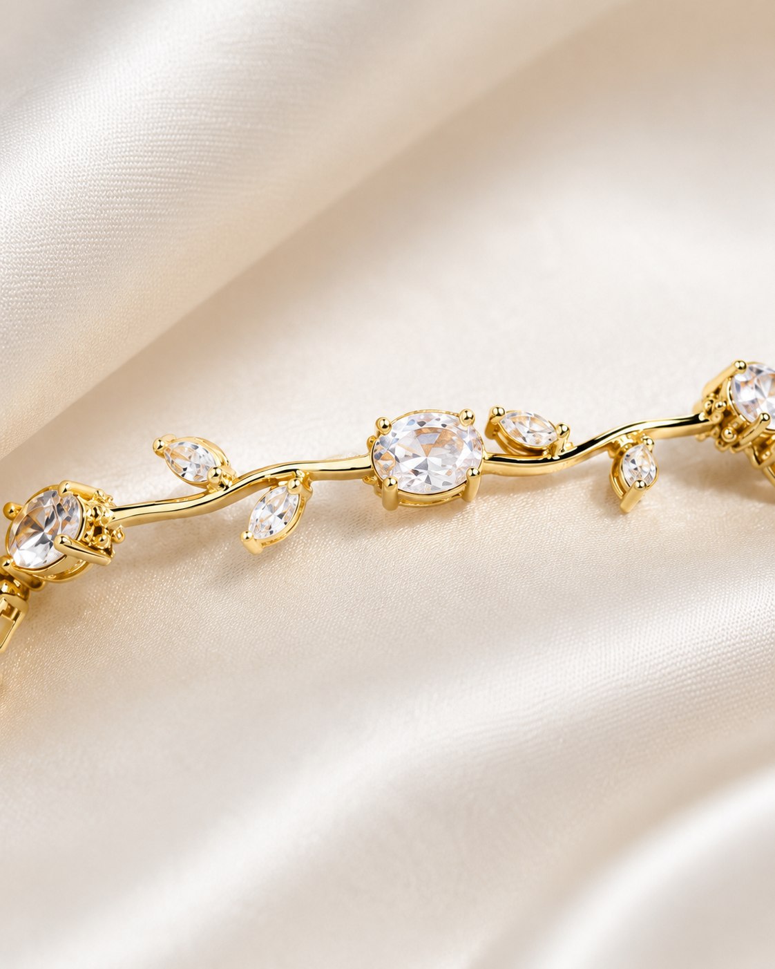 Close-up of Golden Vine Bracelet showing clear crystal accents, gold-tone vine details, and leaf-inspired design.